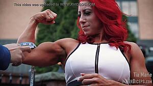 tia marie flexes her muscular biceps during measurements
