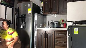 Argentino pounds colombiana roughly in kitchen