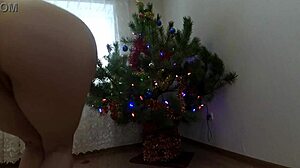 naughty bitch shakes small tits pussy around christmas tree solo tease