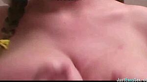 pigtailed brunette squeezes and bounces her huge natural tits solo