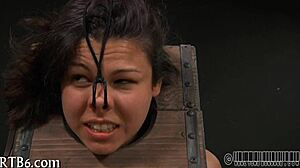 girl strips teasing inside tight cage