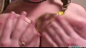 pigtailed brunette squeezes and bounces her huge natural tits solo