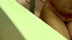 hey, check out this cute japanese wife splashing in the bath with her sexy boobs out.