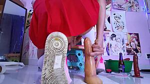 Ladyboy in miniskirt and pigtails trains her gaping ass with monster toys