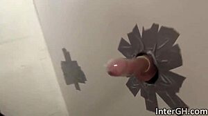 hot ebony babe layton benton slurps huge cock through glory hole wall!