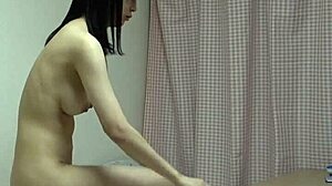 Naked Japanese girl slips into high cut leotard socks