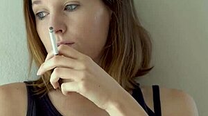 this cute blue-eyed brunette babe smokes teasing her petite voyeur curves slowly