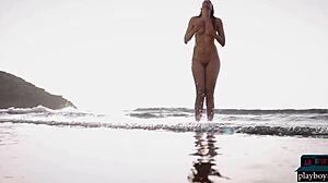 German milf bombshell Jasmin Furry strips furry pussy on beach for Playboy centerfold