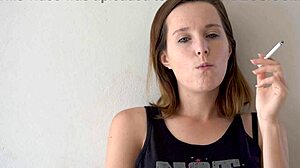 this cute blue-eyed brunette babe smokes teasing her petite voyeur curves slowly