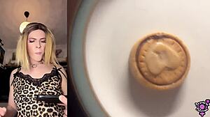 Jessica Bloom edges her big cock then cums on cookie and eats it