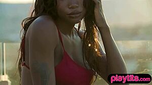 Petite ebony milf strips bare juicy tits poolside