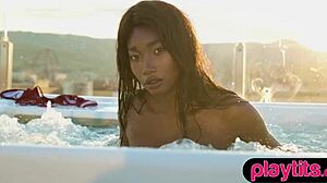 Petite ebony milf strips bare juicy tits poolside