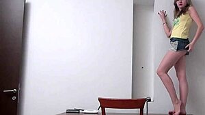 Bridgette's long-legged blonde allure unfolds in teasing desk play