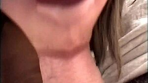 Wifey kneels for homemade blowjob while hubby films her eager suck