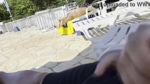 Milf grabs big cock for handjob by public pool leading to massive outdoor cumshot