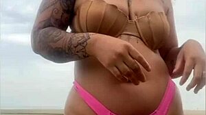 She begs him whip out hard cock from beach shorts