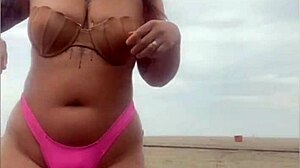 She begs him whip out hard cock from beach shorts