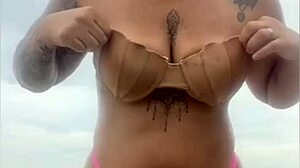 She begs him whip out hard cock from beach shorts