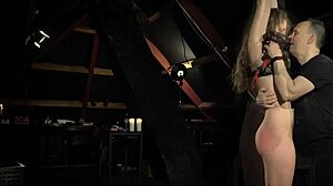 A teeny girl gets bound handcuffed on bed slapped whipped then fucked hard