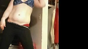 short clip of model oiling up and stripping sexy
