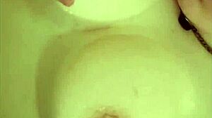 chubby big tits babe plays in bathtub shower with vibrator orgasms