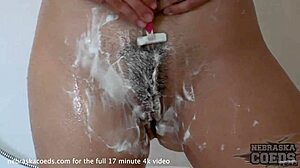 22yo blonde lucia shaves hairy pussy then showers with glass dildo masturbation