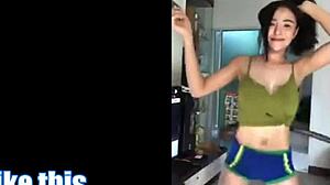 Sweaty Thai whore shakes massive fake tits in erotic dance routine