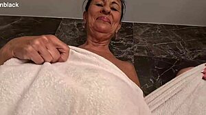 her plump curves glisten as she fingers her big clit to a soaking wet orgasm in the shower