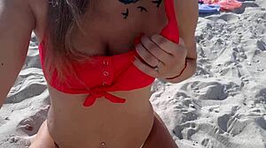 Big tits babe masturbates on crowded beach