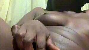 pretty young black babe masturbates her beautiful pussy in amateur solo moment