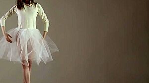 blonde gymnast stretches in flexible acrobatic gymnastics routine