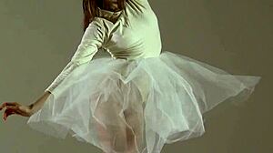 blonde gymnast stretches in flexible acrobatic gymnastics routine