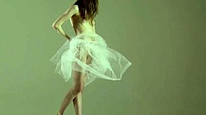 blonde gymnast stretches in flexible acrobatic gymnastics routine