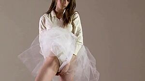 blonde gymnast stretches in flexible acrobatic gymnastics routine