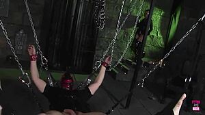 how does that bdsm masked strapon make the brunette cum hard in latex?