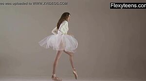 blonde gymnast stretches in flexible acrobatic gymnastics routine