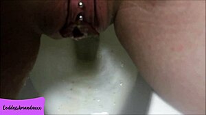 Shaved Pierced Pussy Pees in Bathroom Close-Up