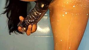 horny colombian squirts hard with dildo in steamy shower play