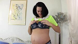 pregnant babe rams dildo deep in wet pussy