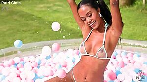 putri cinta poses nude in indonesian paddling pool
