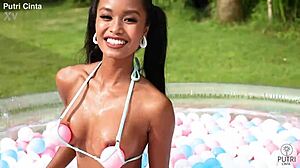 putri cinta poses nude in indonesian paddling pool