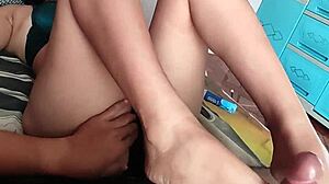 watch this asian college teen stroke my cock with her bare feet
