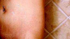 gorgeous blonde steps into steamy shower revealing her petite curves