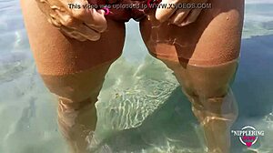 nippleringlover pisses nude on beach spreading pierced pussy wide