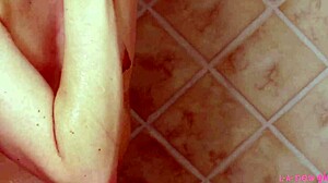 gorgeous blonde steps into steamy shower revealing her petite curves