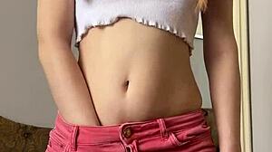 petite teen masturbates shaved pussy with dildo up close