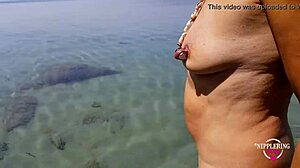 nippleringlover pisses nude on beach spreading pierced pussy wide