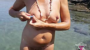 nippleringlover pisses nude on beach spreading pierced pussy wide