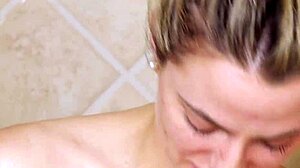gorgeous blonde steps into steamy shower revealing her petite curves