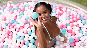 putri cinta poses nude in indonesian paddling pool